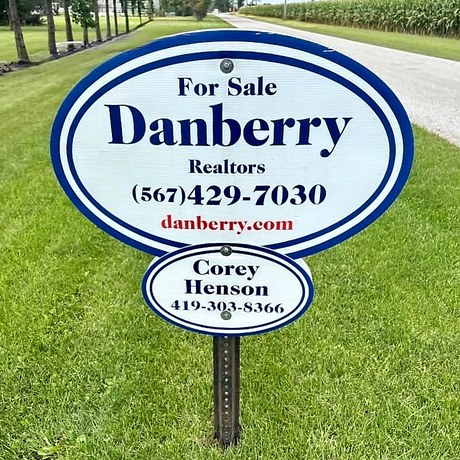 Danberry For Sale yard sign installed on a lawn